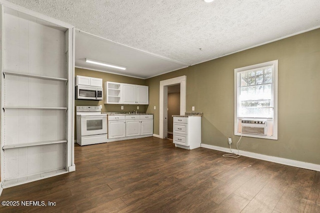kitchen with stainless steel microwave, a textured ceiling, open shelves, and white electric range oven