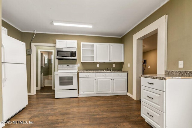 kitchen with white appliances, ornamental molding, dark wood-style flooring, a sink, and white cabinetry