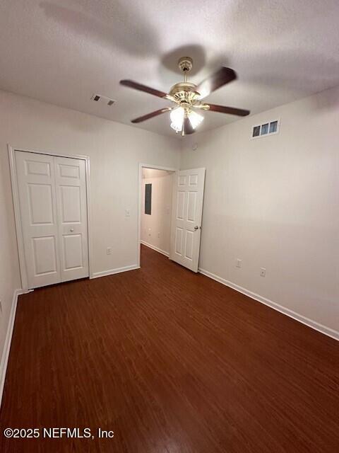 6860 Skaff Ave Unit 2-6, Jacksonville, FL 32244 - interior space with baseboards, visible vents, ceiling fan, and dark wood-style floors