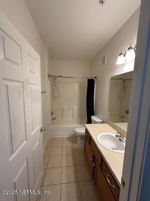 6860 Skaff Ave Unit 2-6, Jacksonville, FL 32244 - full bath featuring tile patterned flooring, bathing tub / shower combination, toilet, vanity, and visible vents