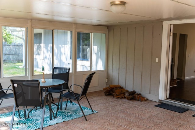 sunroom / solarium featuring a healthy amount of sunlight