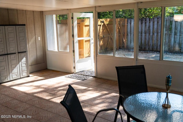 unfurnished sunroom with plenty of natural light