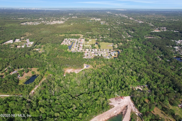 drone / aerial view with a view of trees