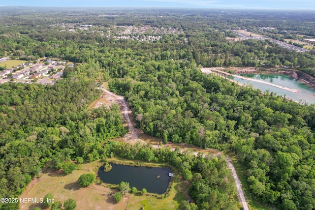aerial view with a view of trees and a water view