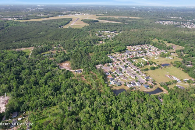 aerial view featuring a forest view