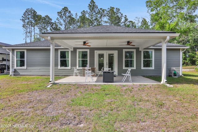 back of house with a patio, a ceiling fan, french doors, and a yard