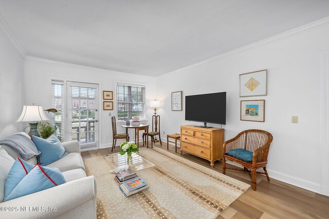 830 Cedar St Unit 830, Jacksonville, FL 32207 - living area featuring crown molding, baseboards, and wood finished floors