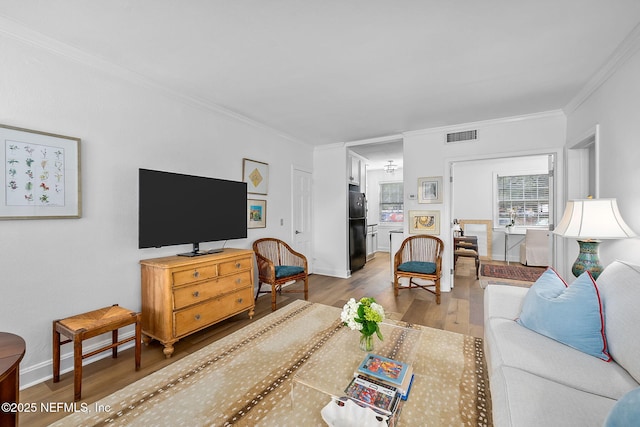 830 Cedar St Unit 830, Jacksonville, FL 32207 - living area featuring ornamental molding, wood finished floors, and visible vents