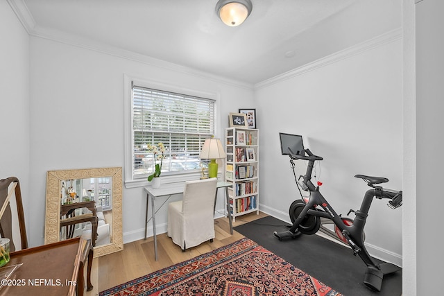 830 Cedar St Unit 830, Jacksonville, FL 32207 - workout room with baseboards, ornamental molding, and wood finished floors