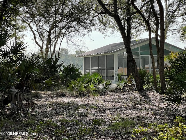 view of yard featuring a sunroom