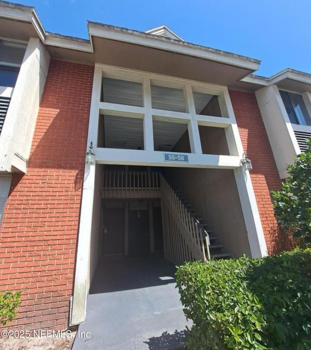 exterior space featuring brick siding