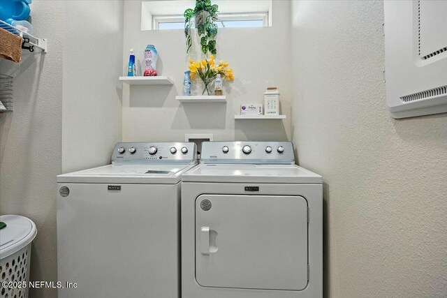 21 Yellow Iris Ct, Ponte Vedra, FL 32081 - laundry room featuring laundry area, a textured wall, and washer and clothes dryer