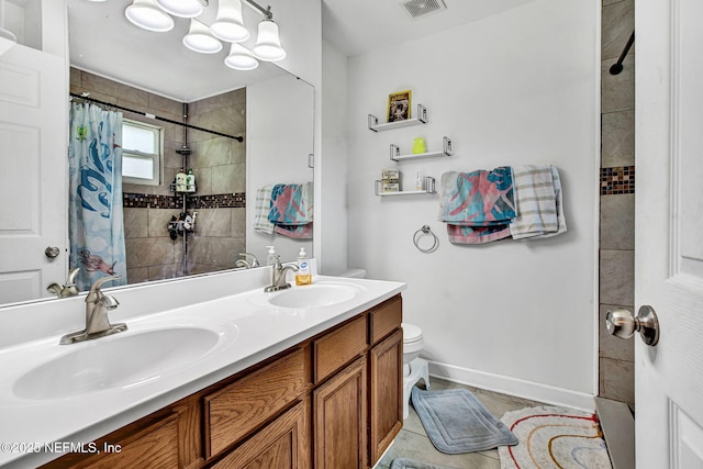 bathroom with visible vents, a sink, a tile shower, and toilet