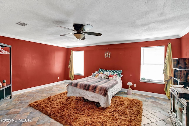 bedroom featuring crown molding, baseboards, a textured ceiling, and visible vents