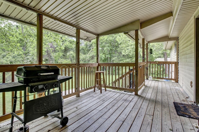 wooden deck featuring area for grilling
