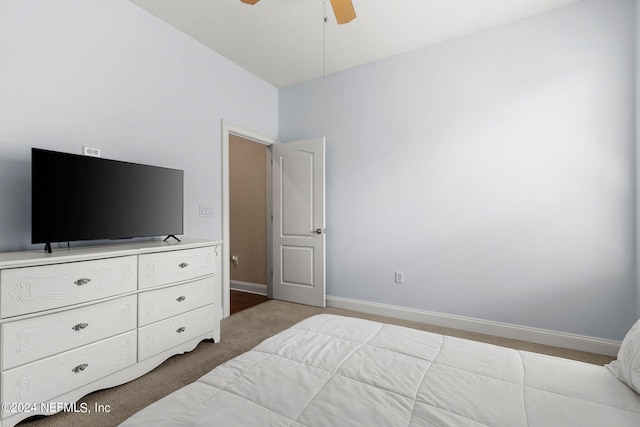 bedroom with baseboards, carpet flooring, and a ceiling fan
