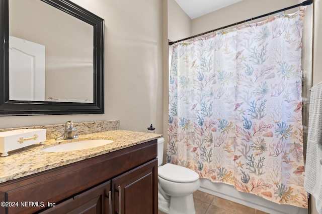bathroom featuring vanity, shower / tub combo with curtain, tile patterned floors, and toilet