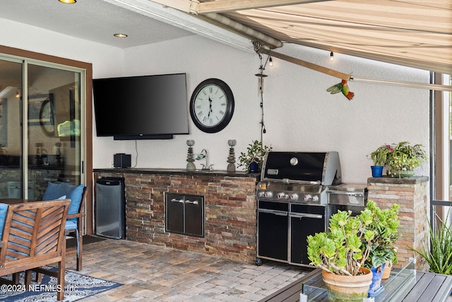 view of patio featuring grilling area and an outdoor kitchen