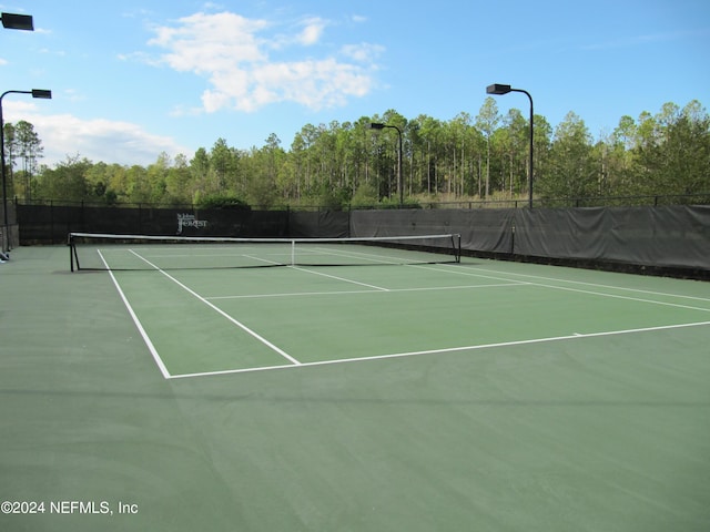 view of sport court featuring community basketball court and fence