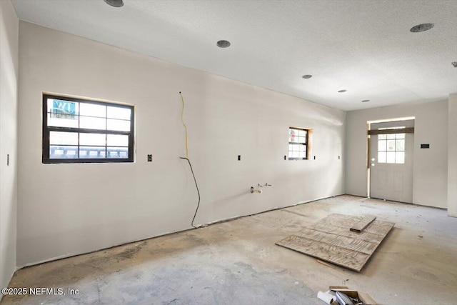 spare room featuring a textured ceiling