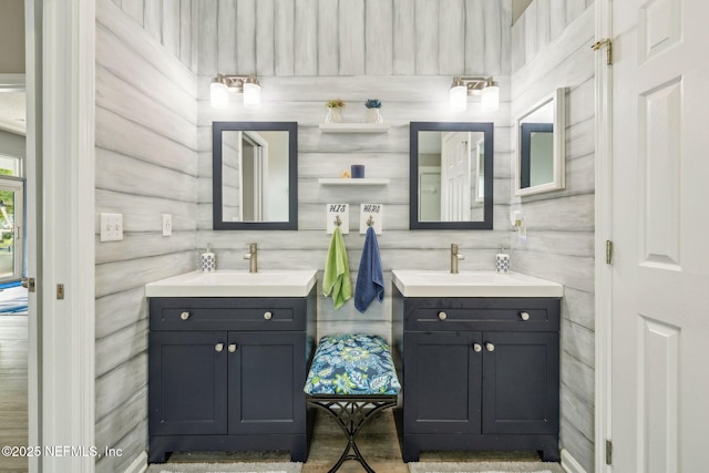 bathroom featuring a sink and two vanities