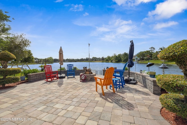 view of patio / terrace with a water view