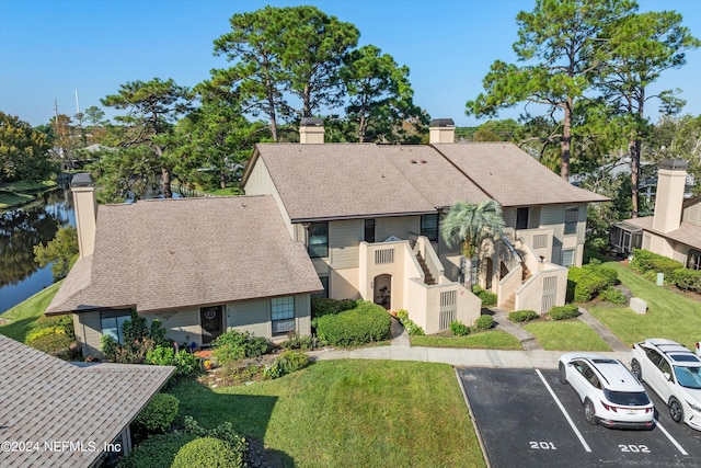 aerial view of residential area with a large body of water