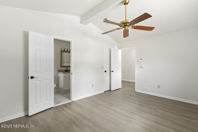 11598 Lazy Willow Ln, Jacksonville, FL 32223 - unfurnished bedroom featuring wood finished floors, connected bathroom, and baseboards