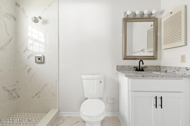 11598 Lazy Willow Ln, Jacksonville, FL 32223 - full bathroom with marble finish floors, a tile shower, toilet, and vanity