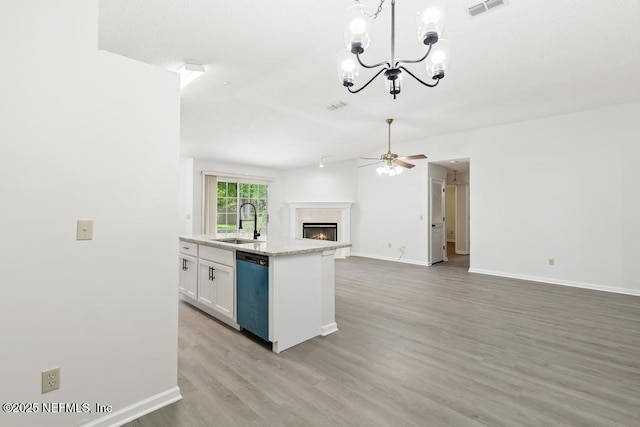 11598 Lazy Willow Ln, Jacksonville, FL 32223 - kitchen with dishwasher, a sink, a ceiling fan, open floor plan, and a chandelier