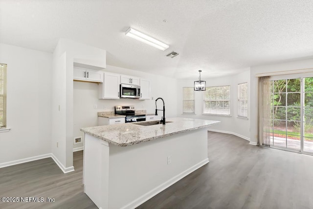 11598 Lazy Willow Ln, Jacksonville, FL 32223 - kitchen featuring stainless steel appliances, a sink, dark wood-type flooring, baseboards, and white cabinetry