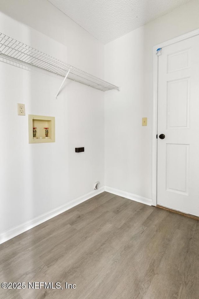 11598 Lazy Willow Ln, Jacksonville, FL 32223 - washroom with washer hookup, wood finished floors, and baseboards