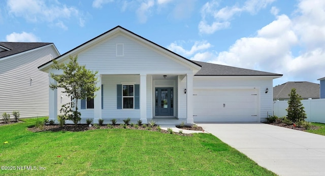 440 Slash Pine Pl, Yulee, FL 32097 - view of front of home with covered porch, a garage, driveway, and a shingled roof