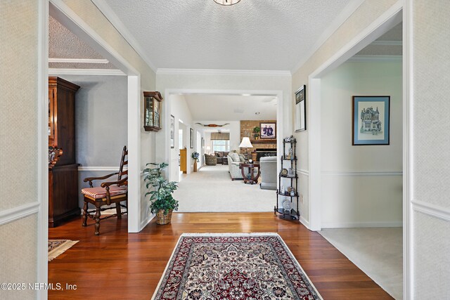 7805 Hunters Grove Rd, Jacksonville, FL 32256 - entryway featuring crown molding, baseboards, and wood finished floors