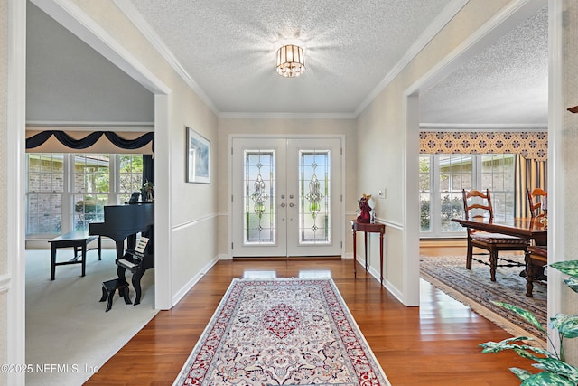7805 Hunters Grove Rd, Jacksonville, FL 32256 - foyer entrance featuring crown molding, a textured ceiling, french doors, and wood finished floors