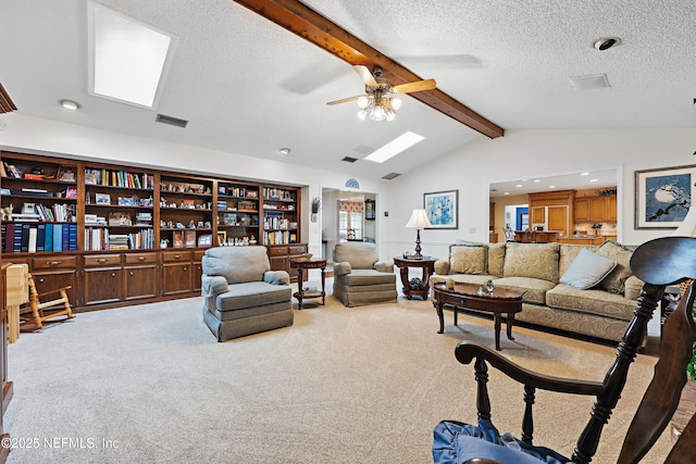 7805 Hunters Grove Rd, Jacksonville, FL 32256 - living area with carpet flooring, ceiling fan, vaulted ceiling with skylight, recessed lighting, and visible vents