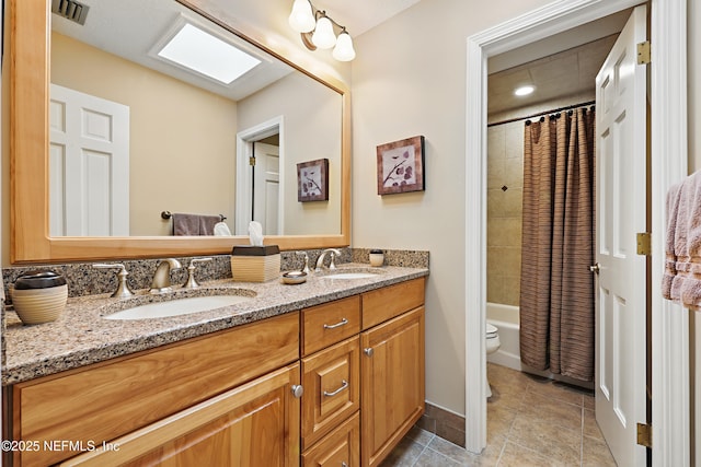 7805 Hunters Grove Rd, Jacksonville, FL 32256 - bathroom with visible vents, a sink, double vanity, and toilet