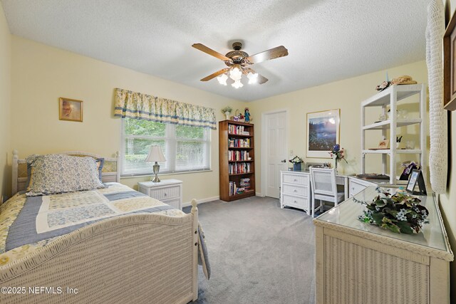 7805 Hunters Grove Rd, Jacksonville, FL 32256 - bedroom with baseboards, a ceiling fan, carpet flooring, and a textured ceiling