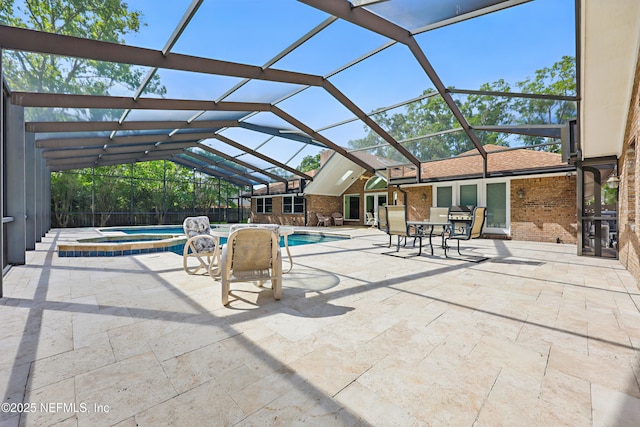 7805 Hunters Grove Rd, Jacksonville, FL 32256 - view of pool featuring a patio, a pool with connected hot tub, and glass enclosure