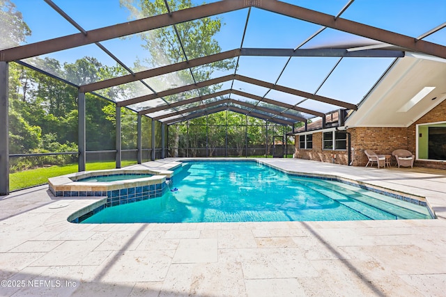 7805 Hunters Grove Rd, Jacksonville, FL 32256 - view of swimming pool with a lanai, a pool with connected hot tub, and a patio area