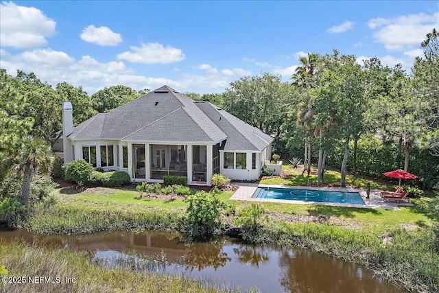 408 Osprey Lookout Ct Unit 29, Ponte Vedra Beach, FL 32082 - back of property featuring an outdoor pool, a chimney, a sunroom, and a water view