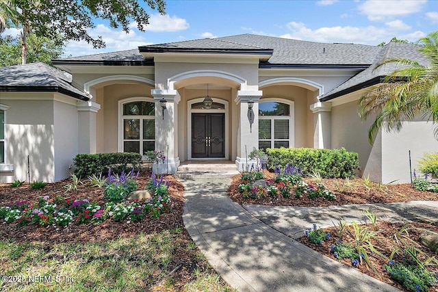 408 Osprey Lookout Ct Unit 29, Ponte Vedra Beach, FL 32082 - property entrance with stucco siding and a shingled roof