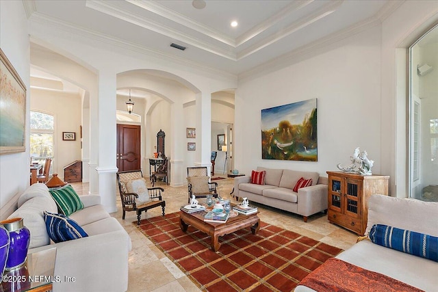 408 Osprey Lookout Ct Unit 29, Ponte Vedra Beach, FL 32082 - living room featuring arched walkways, a tray ceiling, crown molding, ornate columns, and recessed lighting