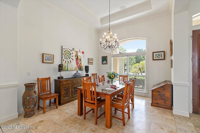 408 Osprey Lookout Ct Unit 29, Ponte Vedra Beach, FL 32082 - dining area featuring a chandelier, ornamental molding, a towering ceiling, baseboards, and a tray ceiling