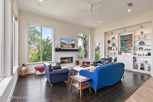 408 Osprey Lookout Ct Unit 29, Ponte Vedra Beach, FL 32082 - living room with crown molding, a ceiling fan, dark wood finished floors, a glass covered fireplace, and baseboards
