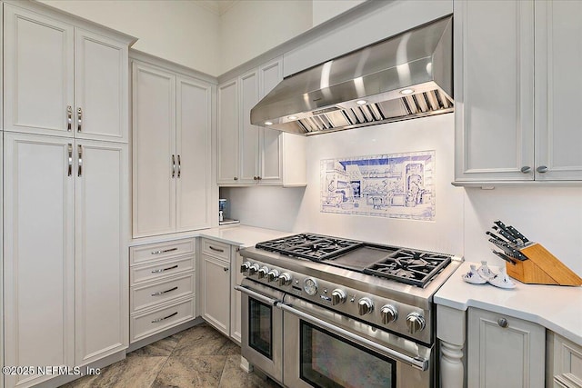 408 Osprey Lookout Ct Unit 29, Ponte Vedra Beach, FL 32082 - kitchen with wall chimney exhaust hood, double oven range, and light countertops