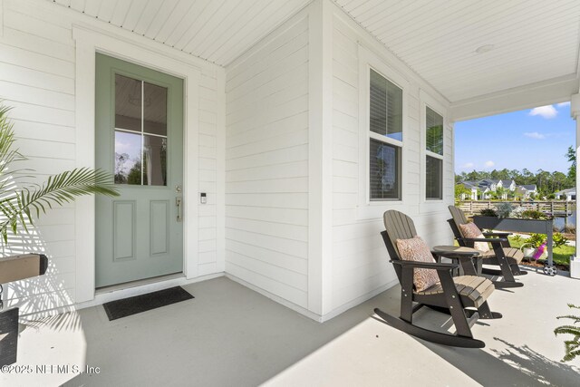 109 Redbud Ln, Yulee, FL 32097 - view of exterior entry featuring a porch