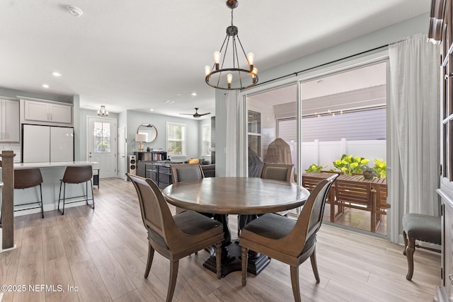 109 Redbud Ln, Yulee, FL 32097 - dining space featuring recessed lighting, ceiling fan with notable chandelier, and light wood-style floors