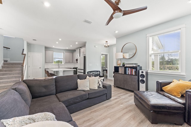 109 Redbud Ln, Yulee, FL 32097 - living room featuring ceiling fan, light wood-style floors, recessed lighting, visible vents, and stairway