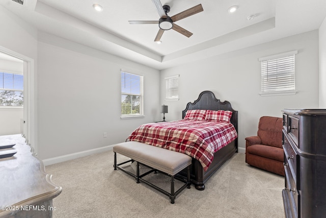 109 Redbud Ln, Yulee, FL 32097 - bedroom with a tray ceiling, light colored carpet, multiple windows, and baseboards
